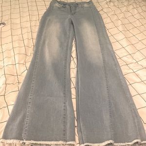 EMERY ROSE light wash raw hem flare leg jeans.